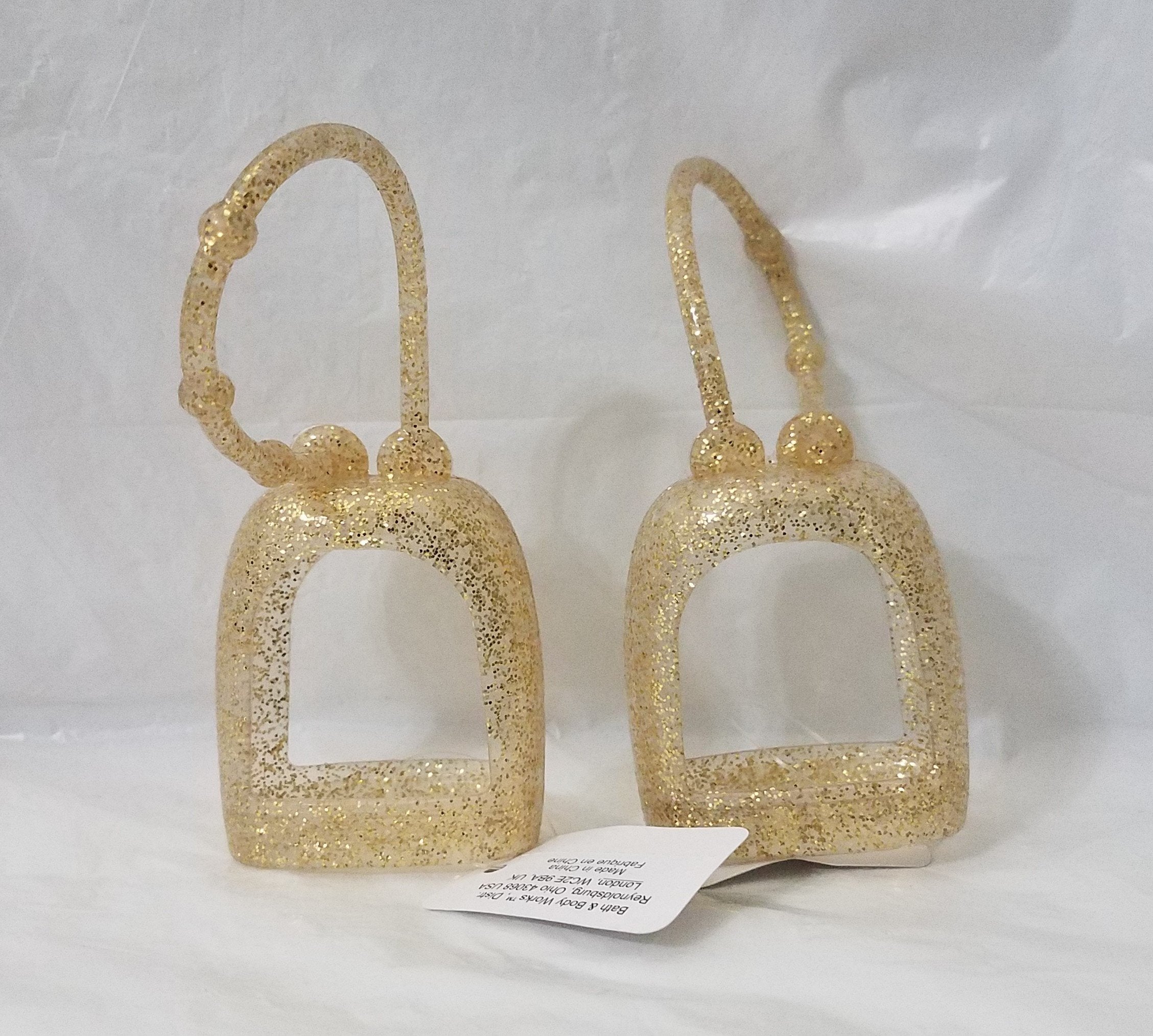 Bath and Body Works PocketBac Sparkled Gold holder keeps sanitizer handy on the go.