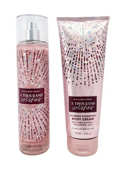 Bath & Body Works Thousand Wishes Fine Fragrance Mist bottle on iridescent pink packaging for long lasting scent