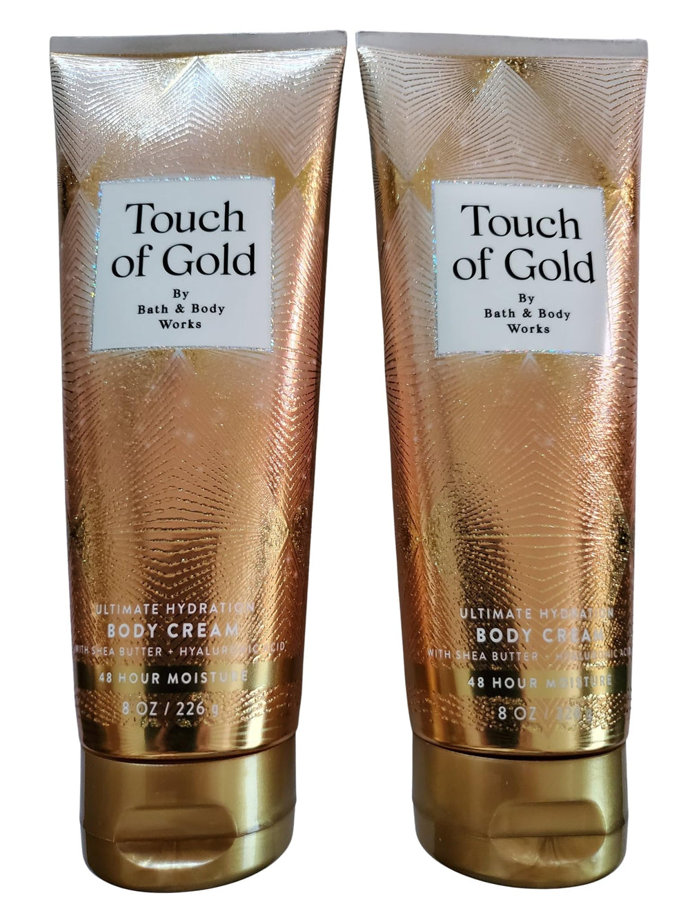 Bath and Body Works Touch of Gold bottle highlighting rich hydration for daily moisture.