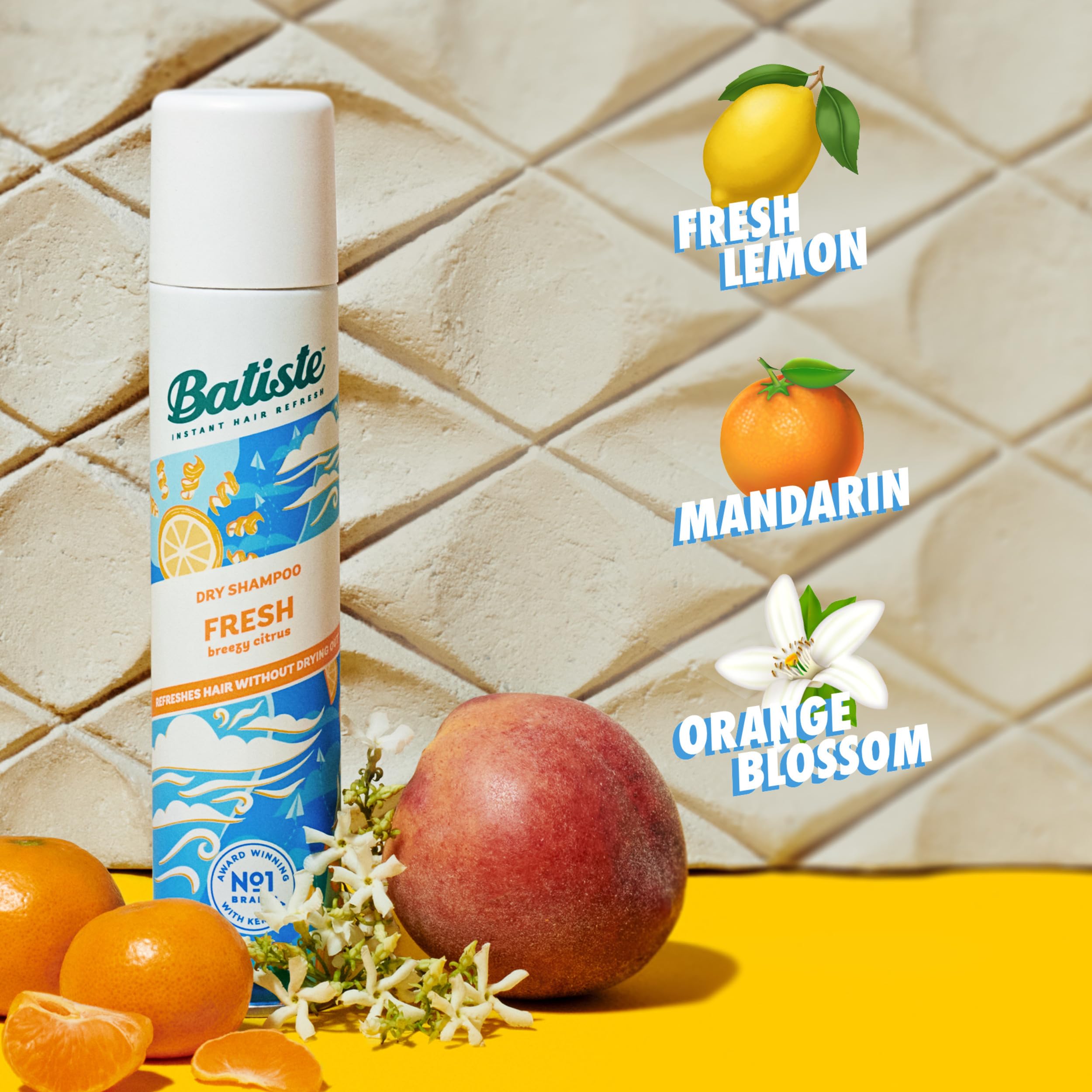 Shake and dispense action of Batiste Fresh Dry Shampoo.