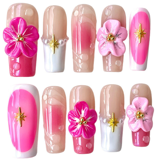 BByogooz pink Sakura 3D nails closeup highlighting delicate blossoms and a glossy finish