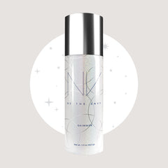 BE THE ENVY NV Perfecting Mist Shimmer glow on cheekbones highlights a moonlit sparkle.