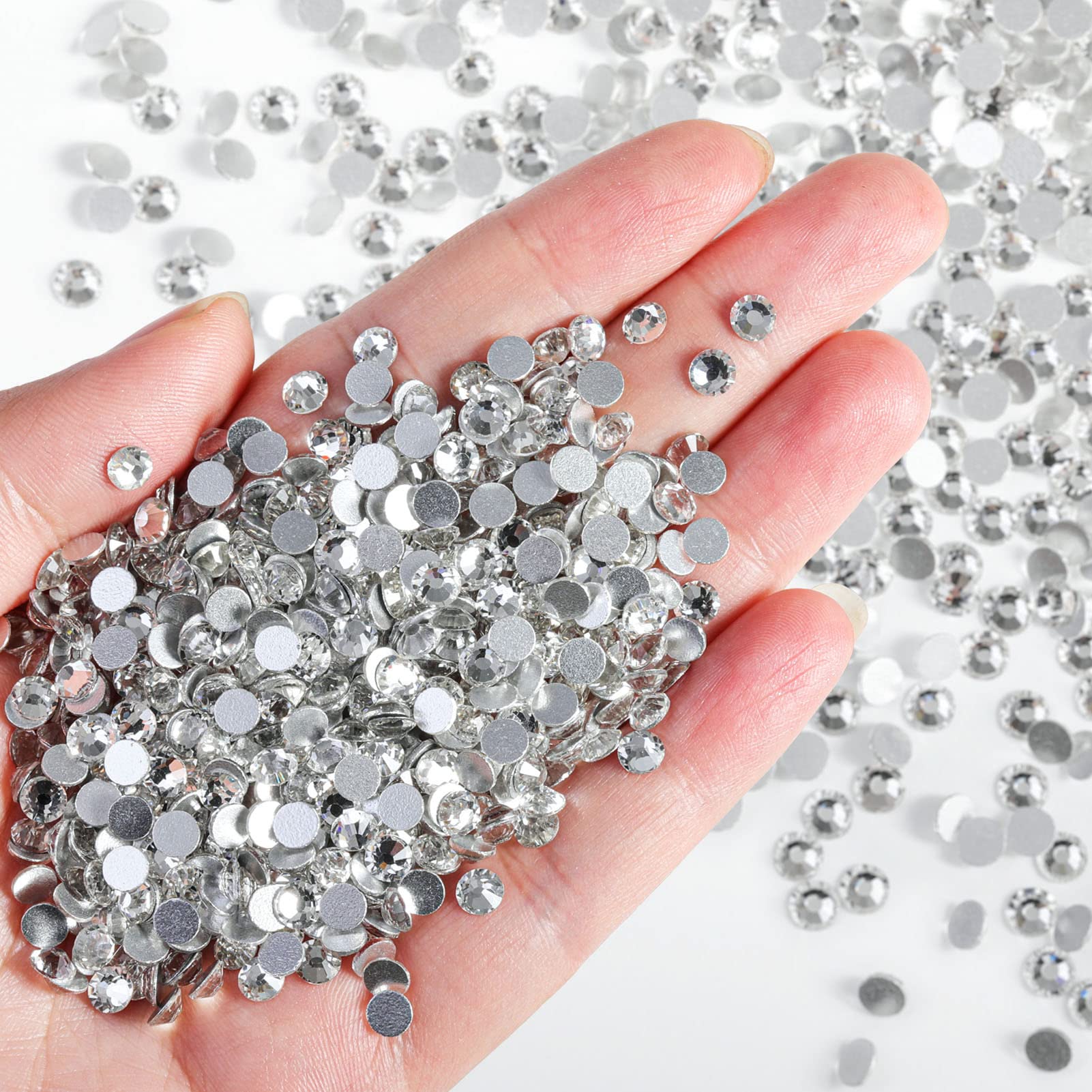BEADSLAND rhinestones bulk pack shown on nails and fashion accessories.