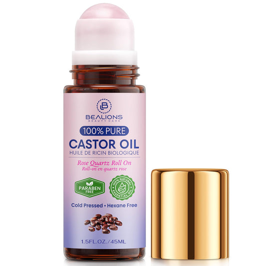 Bealions Castor Oil Roll-On on face with rose quartz roller for soothing, hydrating skincare