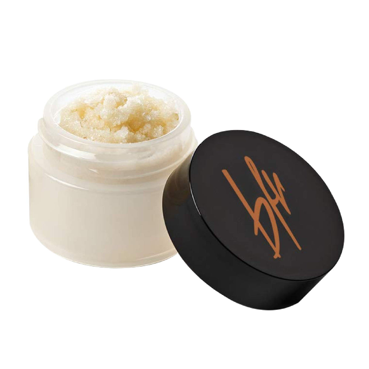 Beauty For Real Lip Revival Orange Spice tube closeup showing exfoliating sugar texture.