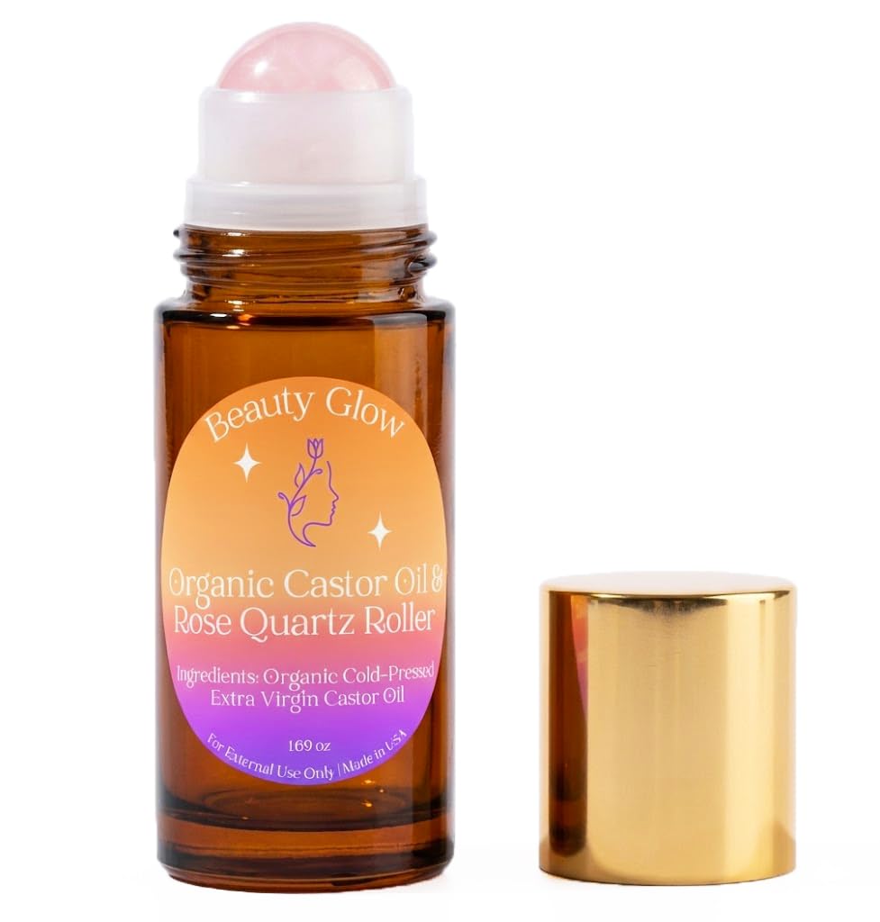 Beauty Glow castor oil bottle with rose quartz roller for skin nourishment.
