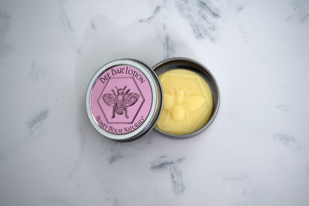Bee Bar Honey House Naturals Duo Lavender open tin reveals creamy balm texture for hands.