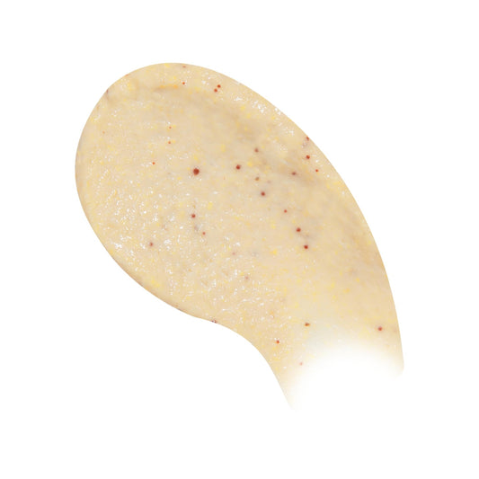 Beekman 1802 Coconut Cream Exfoliating Milk Scrub ingredient close-up shows goat milk and jojoba beads.