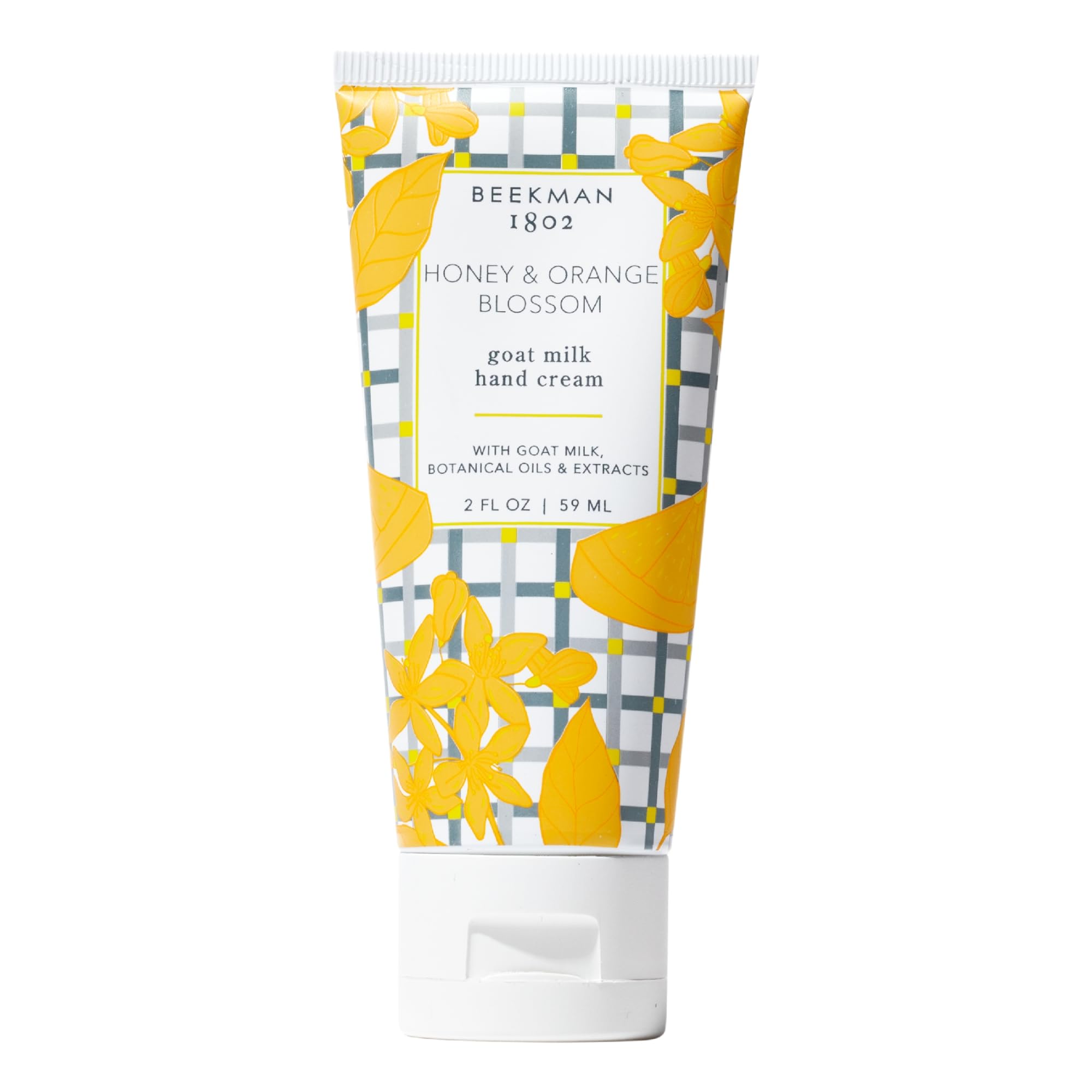 Beekman 1802 Goat Milk Hand Cream bottle front label with honey and orange blossom scent, ideal for hydration.