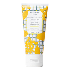 Beekman 1802 Goat Milk Hand Cream bottle front label with honey and orange blossom scent, ideal for hydration.