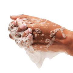 Creamy goat milk hand wash lather close-up.