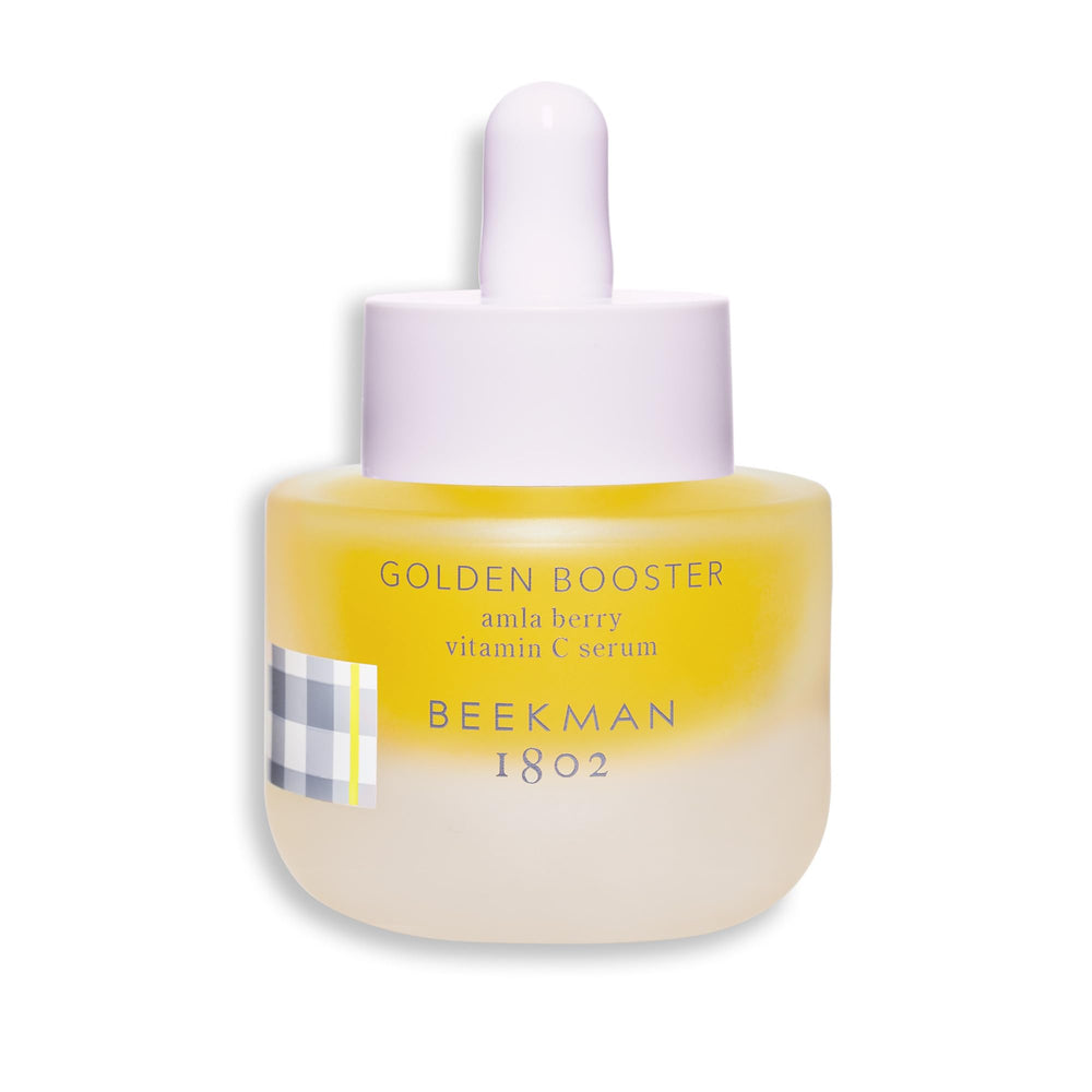 Beekman 1802 Golden Booster Amla Berry Serum bottle with dropper for radiant skin