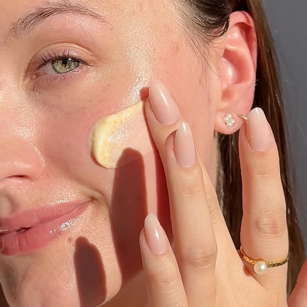 Beekman 1802 Milk Scrub pour into palm, ready for soft exfoliation