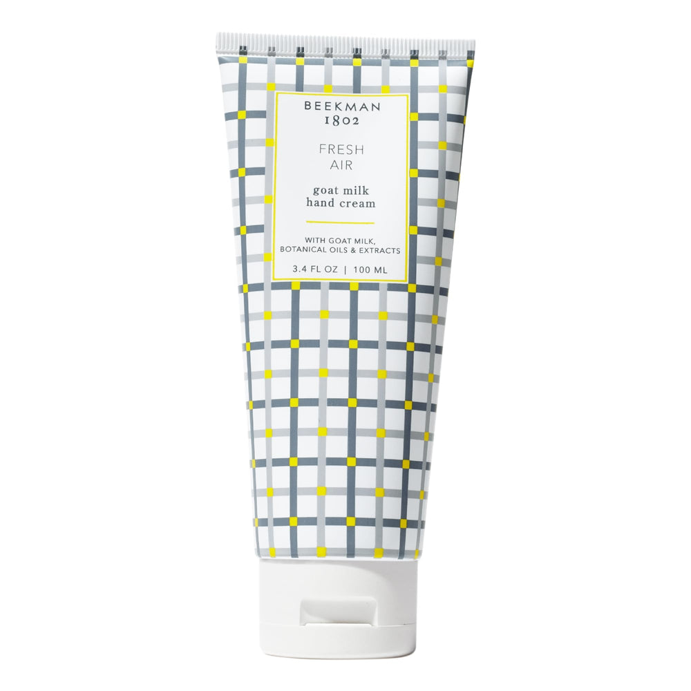Beekman 1802 Pure Goat Milk Hand Cream Fresh Air bottle shows portable hydration for skin.