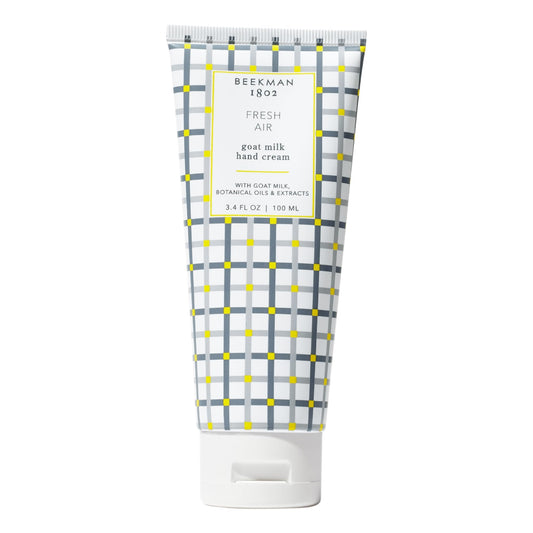 Beekman 1802 Pure Goat Milk Hand Cream Fresh Air bottle shows portable hydration for skin.