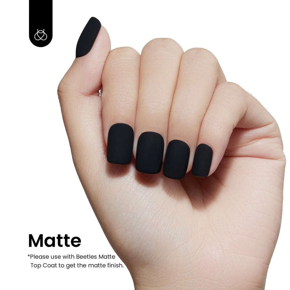 Beetles gel nail polish being applied with base and top coat for durability.