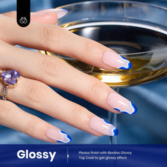 Beetles Blue Gel Polish curing under LED lamp for quick, even shine.