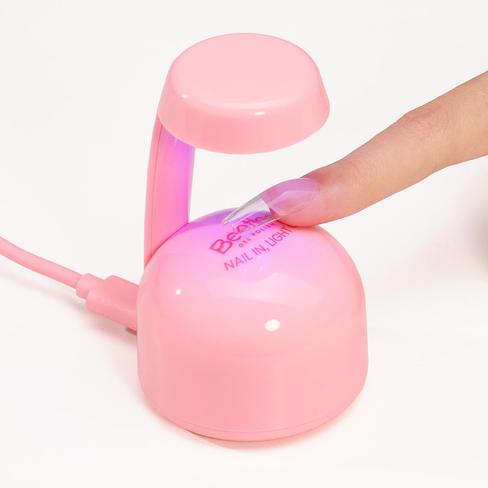 Beetles Mini UV Light at-home manicure tool with salon-like results.