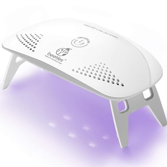 Beetles UV light nail lamp shown for travel, compact and portable for on-the-go manicures.
