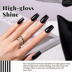 Beetles Valentine-inspired nails in black and white for chic at-home styling.