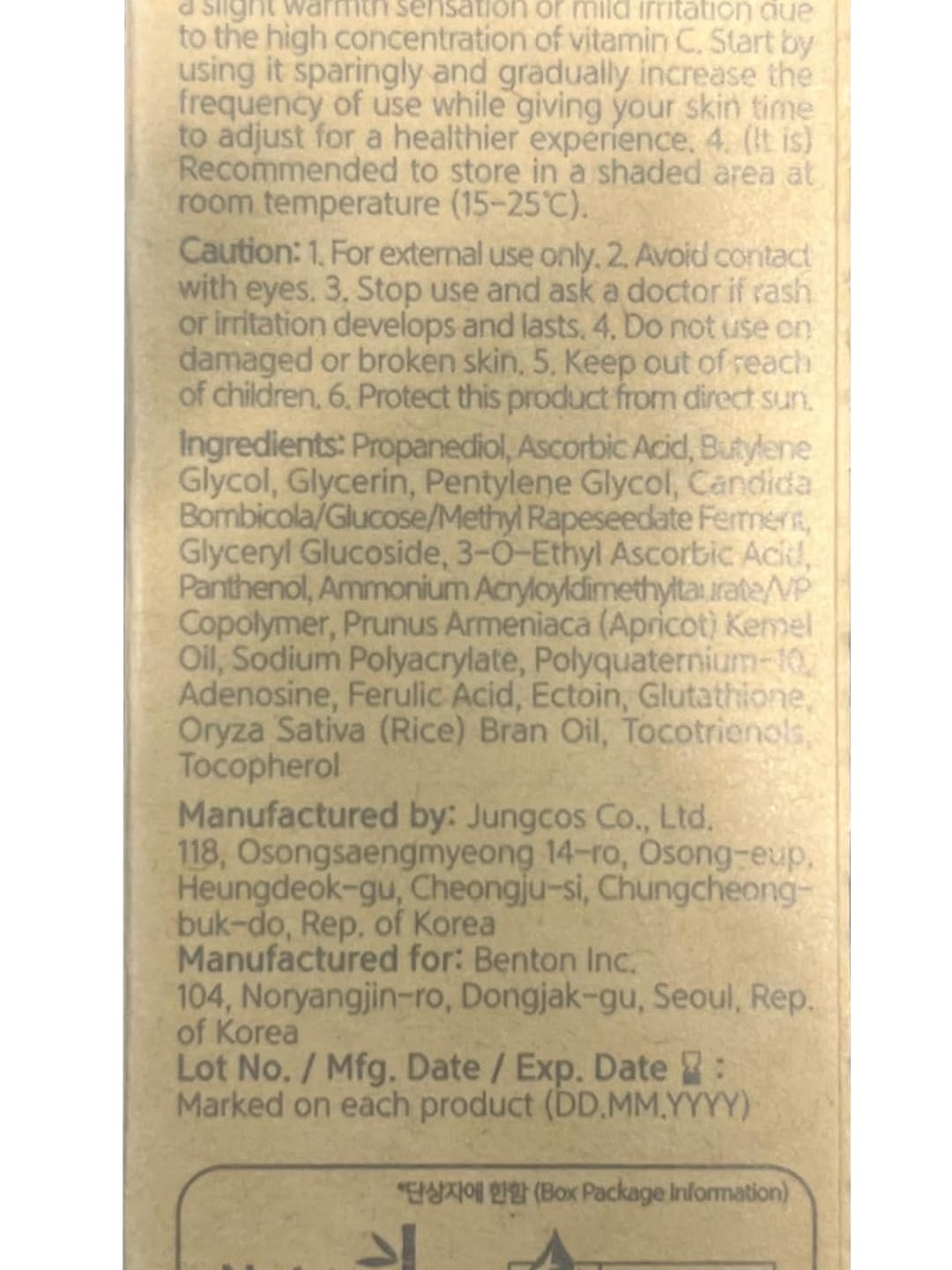 BENTON Vitamin C Serum bottle on a nightstand with soft lighting for evening use.
