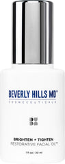 Beverly Hills MD Brighten + Tighten oil bottle on a clean vanity for premium daily care.
