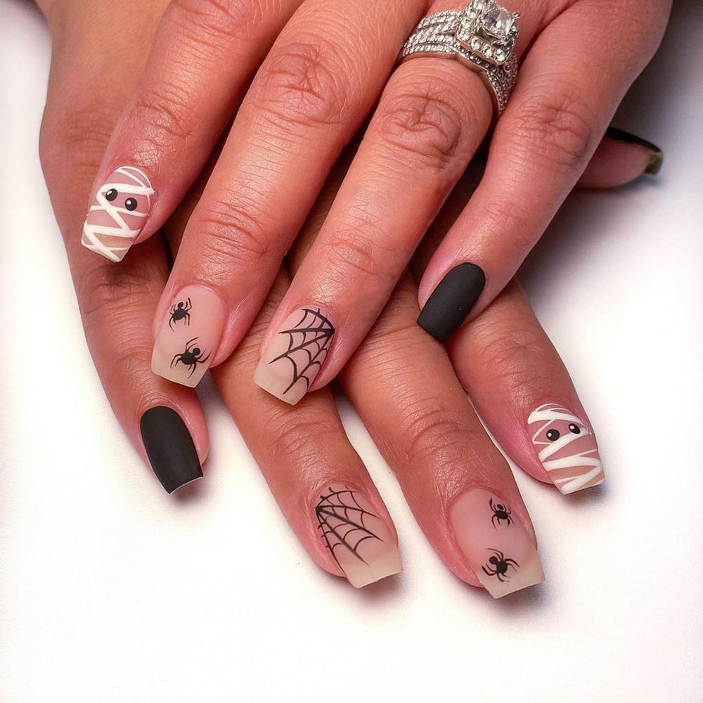 BHOOKA glossy finish nails for shiny Halloween mani.