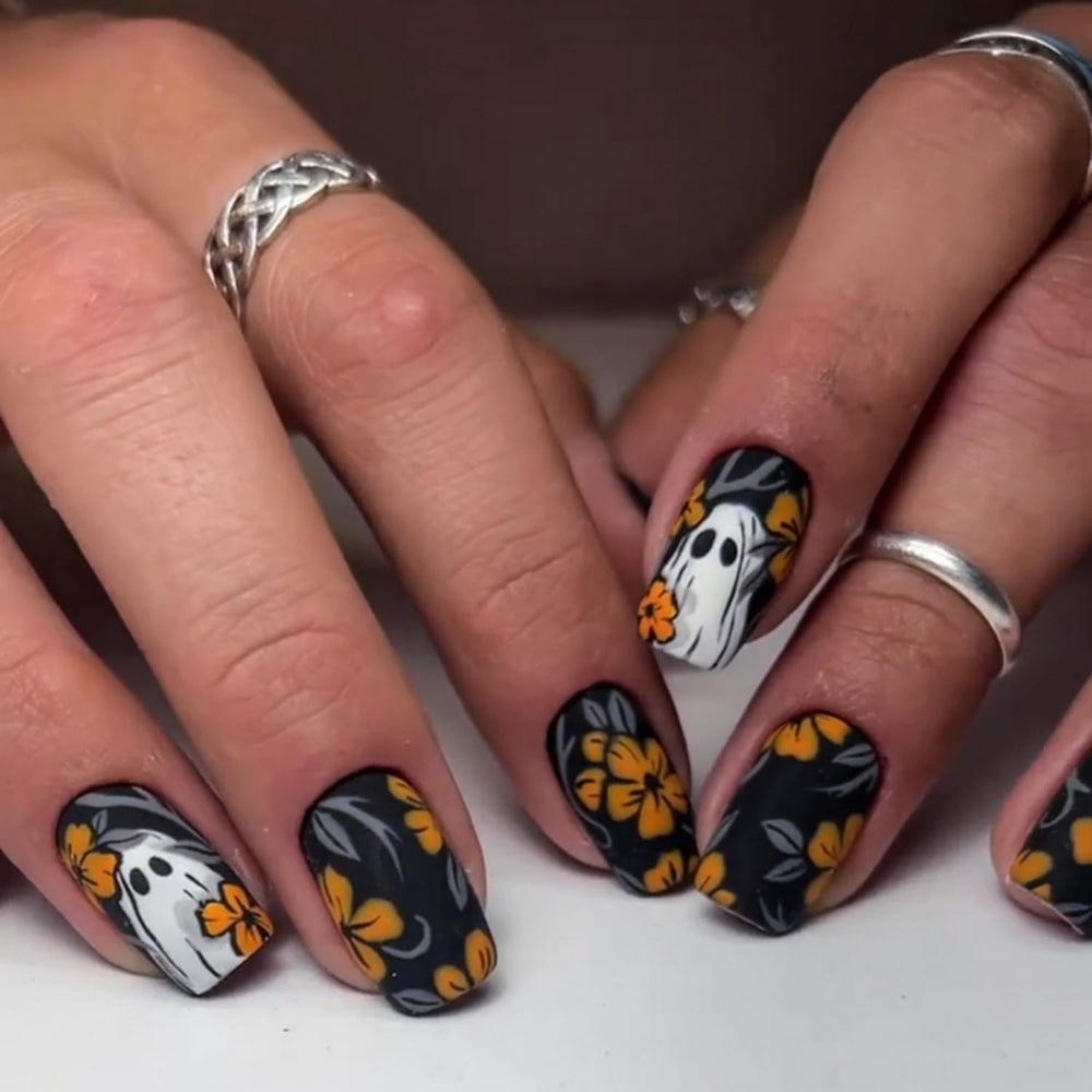 BHOOKA pumpkin-art nails add playful seasonal flair to any manicure.