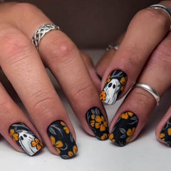 BHOOKA pumpkin-art nails add playful seasonal flair to any manicure.