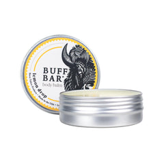 Packaging of Buff Bar Lemon Drop 2 oz tin is portable for travel skincare routines.