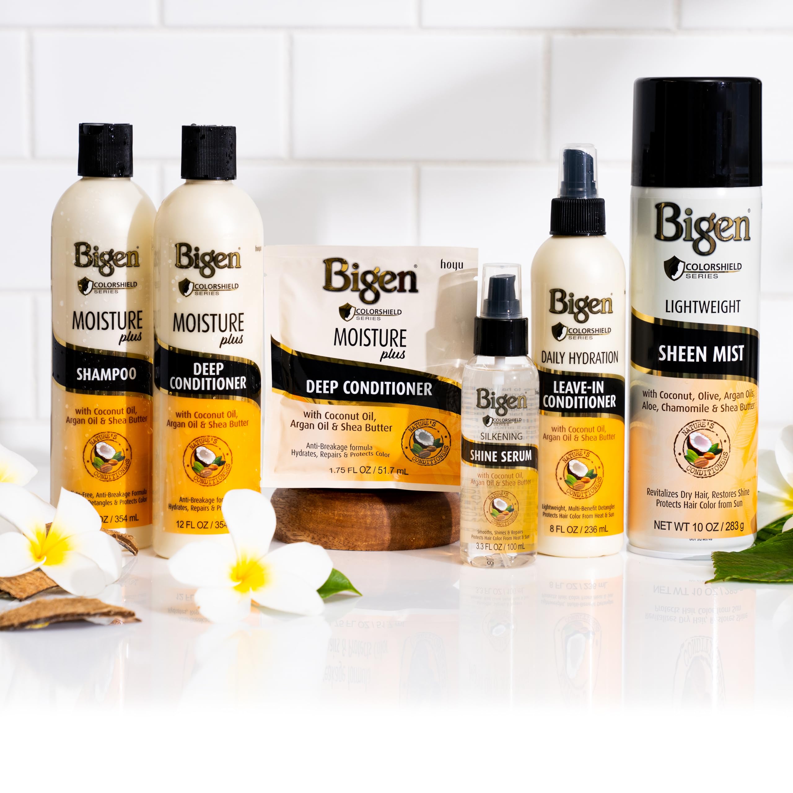Bigen Silkening Shine Serum being applied to hair for silky finish.