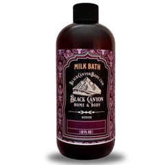 Black Canyon Tobacco Vanilla Milk & Bubble Bath bottle pour for a cozy, fragrant soak.