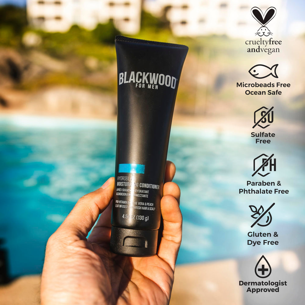 Hands applying HydroBlast conditioner to hair for nourishment