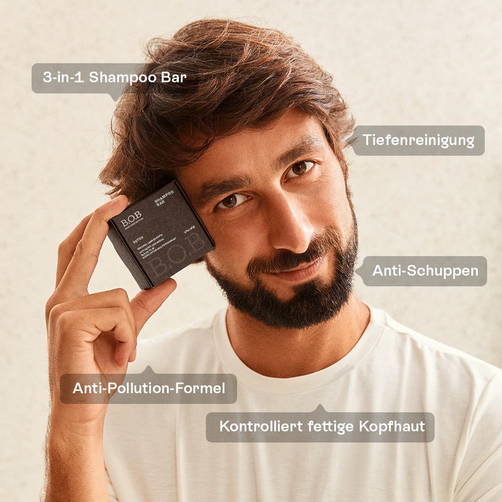 B.O.B Detox Solid Shampoo Bar held in hands demonstrates portable, travel-friendly hair care.