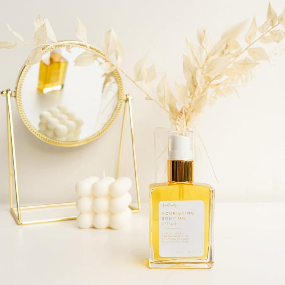 Bonblissity Nourishing Body Oils at elbows and knees showing targeted hydration