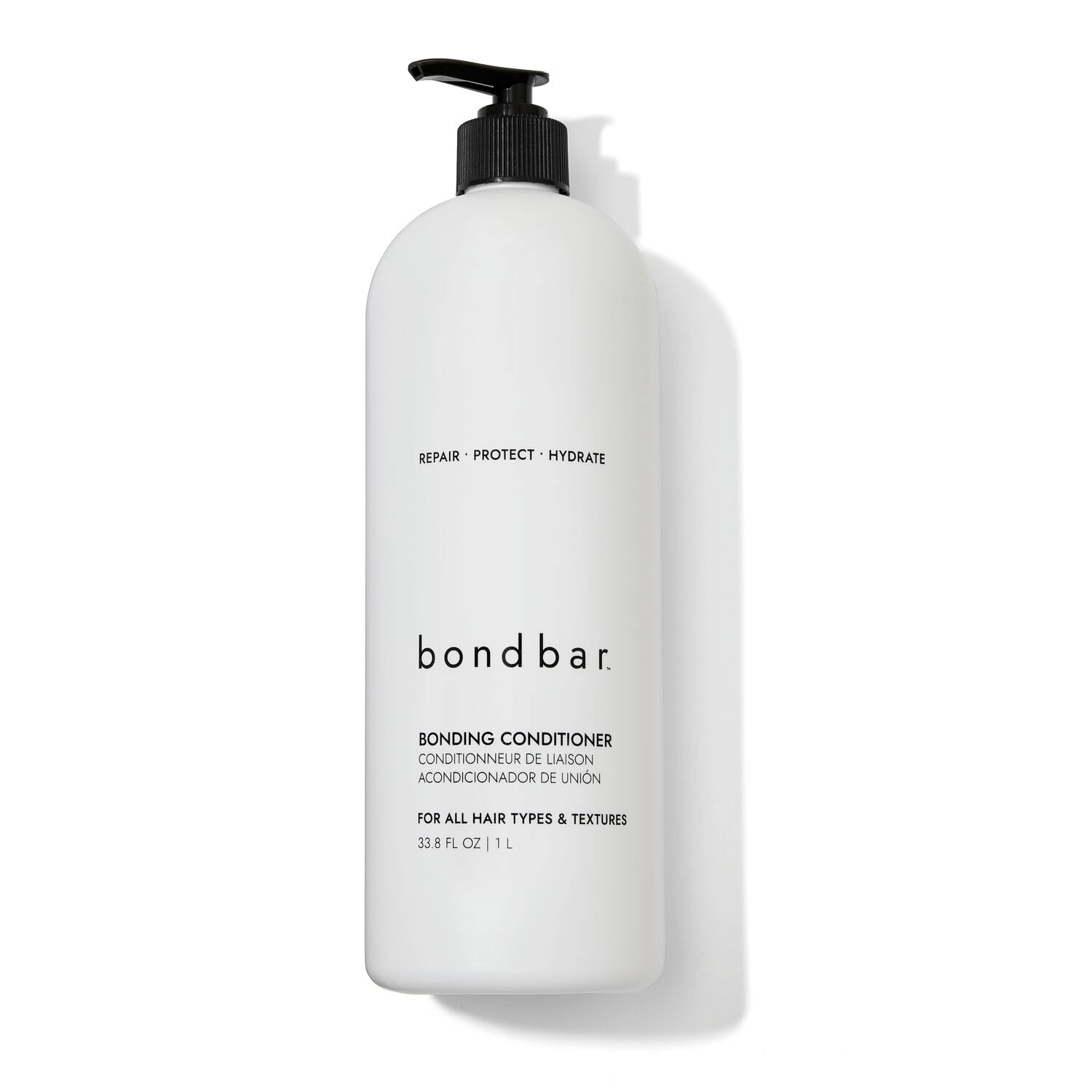 Bondbar conditioner bottle being poured for damaged hair care and repair