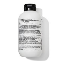 Bondbar Treatment hair strand close-up during application, promoting smoothness