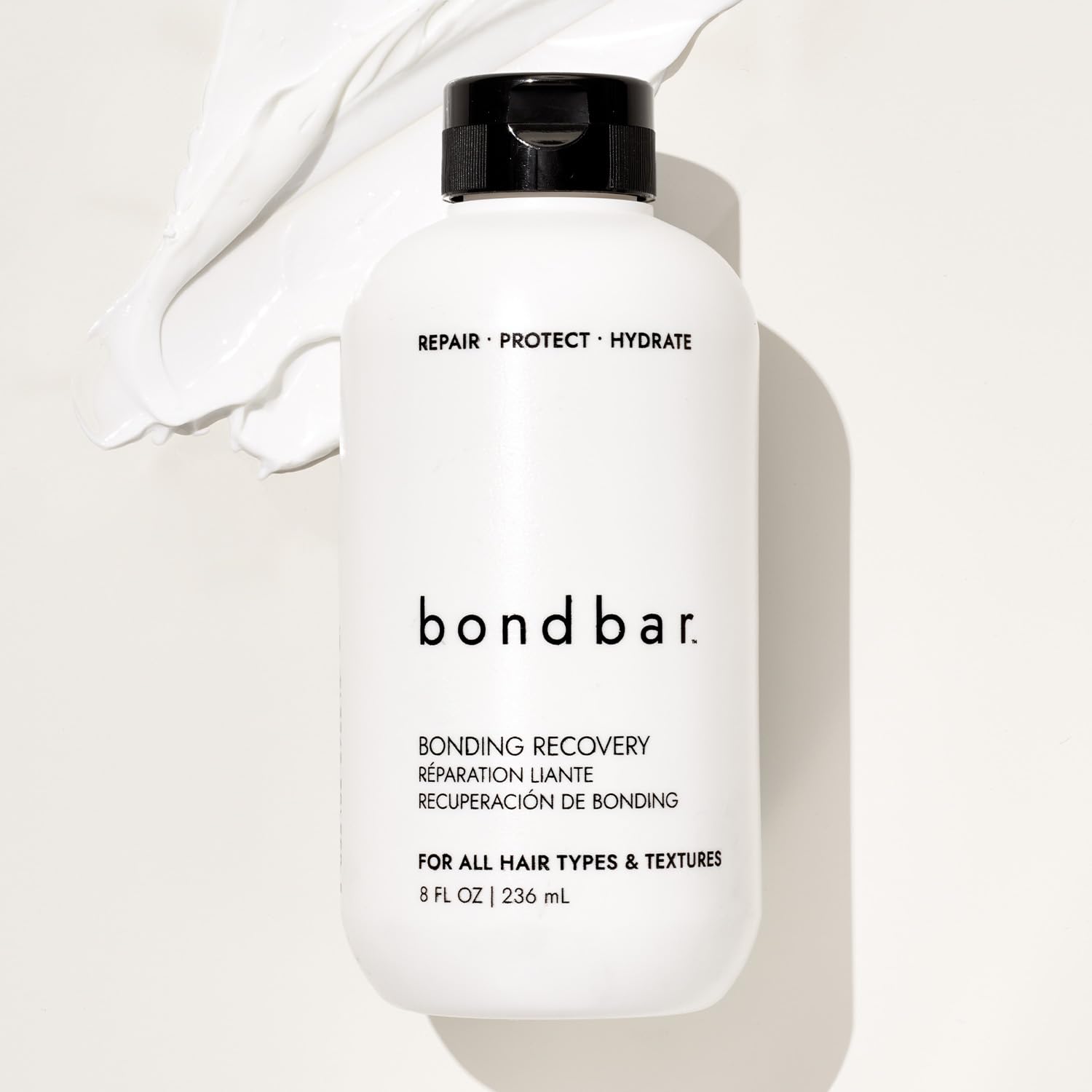Bondbar Treatment hands applying cream on hair for even moisture distribution
