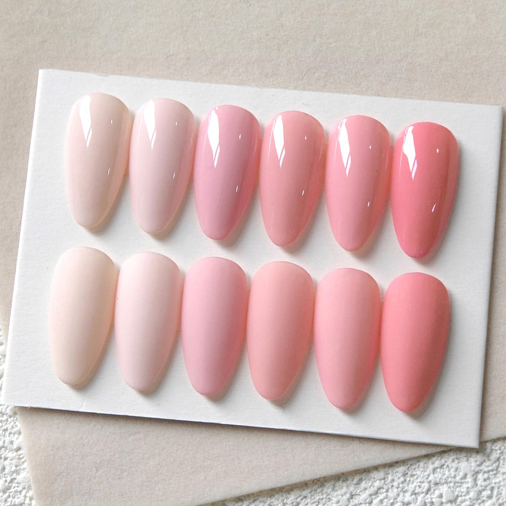 Brush applying nude pink gel polish with smooth, single-stroke color