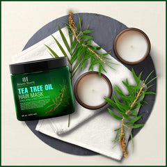 Rinsing Botanic Hearth Tea Tree Hair Mask to reveal refreshed strands