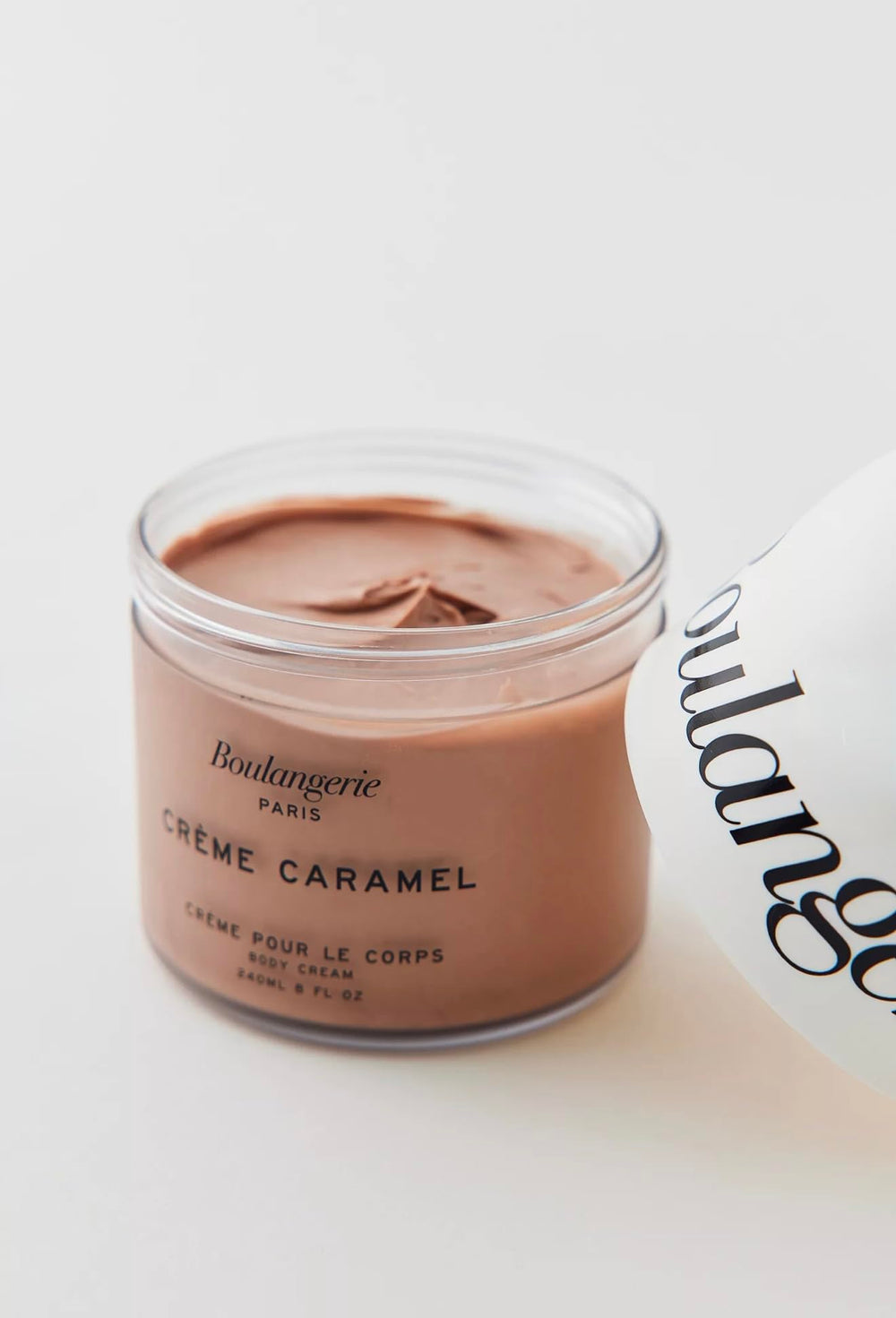 Close-up of Boulangerie Paris Creme Caramel Body Cream texture showing whipped hydration.