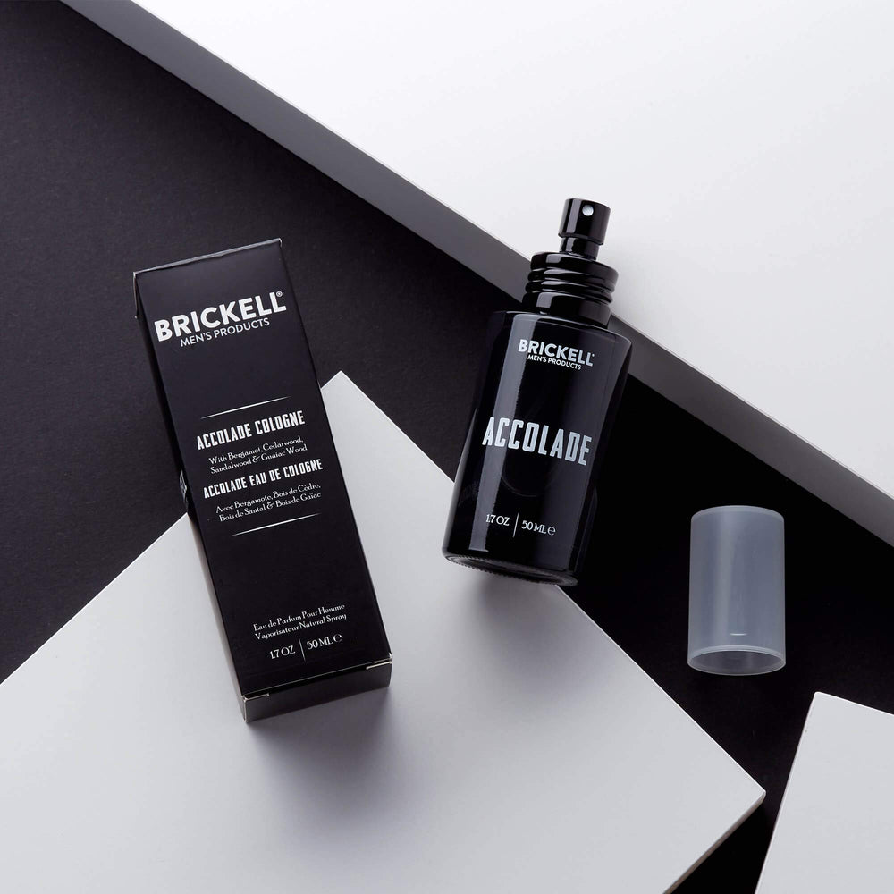 Brickell Men's Accolade bottle closeup highlights cedarwood and sandalwood notes