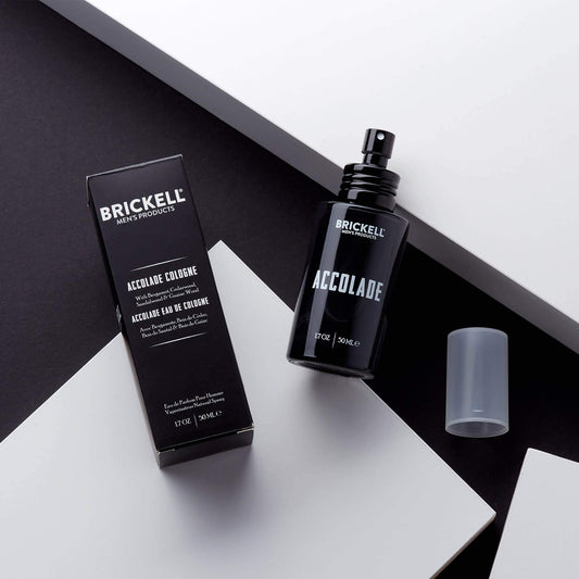 Brickell Men's Accolade bottle closeup highlights cedarwood and sandalwood notes