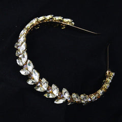 Brihasory gold-tone crystal headband side view adds elegance.