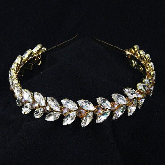 Brihasory green rhinestone headband closeup shows crystal facets.