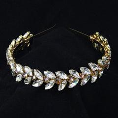Brihasory green rhinestone headband closeup shows crystal facets.