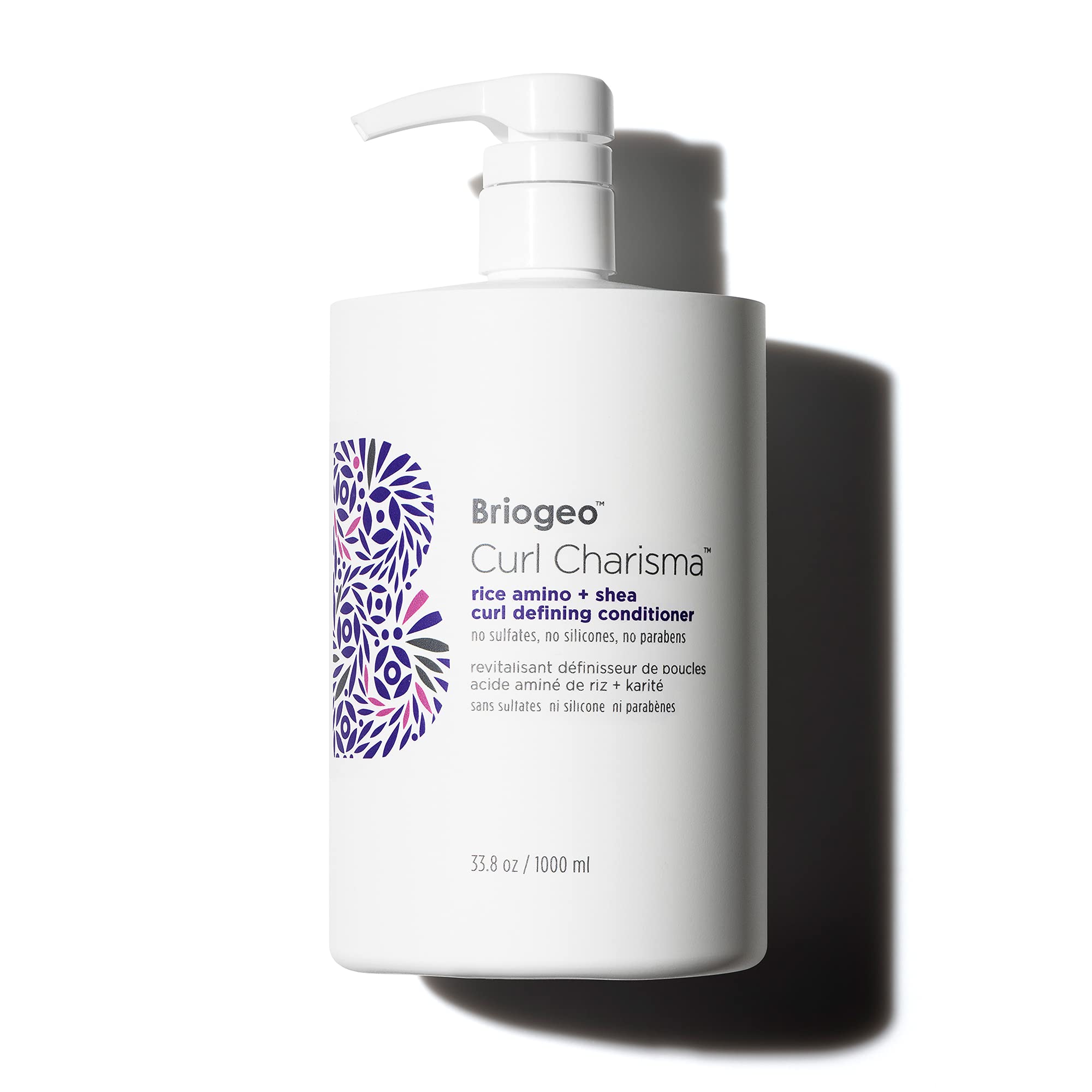 Briogeo Curl Charisma bottle pour demonstrates hydrating formula for defined curls.