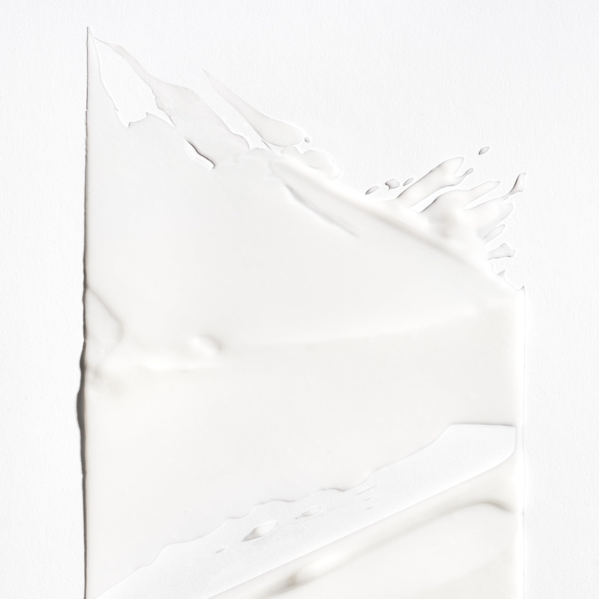 Briogeo Curl Charisma cream texture close-up highlights creamy moisture for soft results.