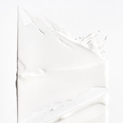 Briogeo Curl Charisma cream texture close-up highlights creamy moisture for soft results.