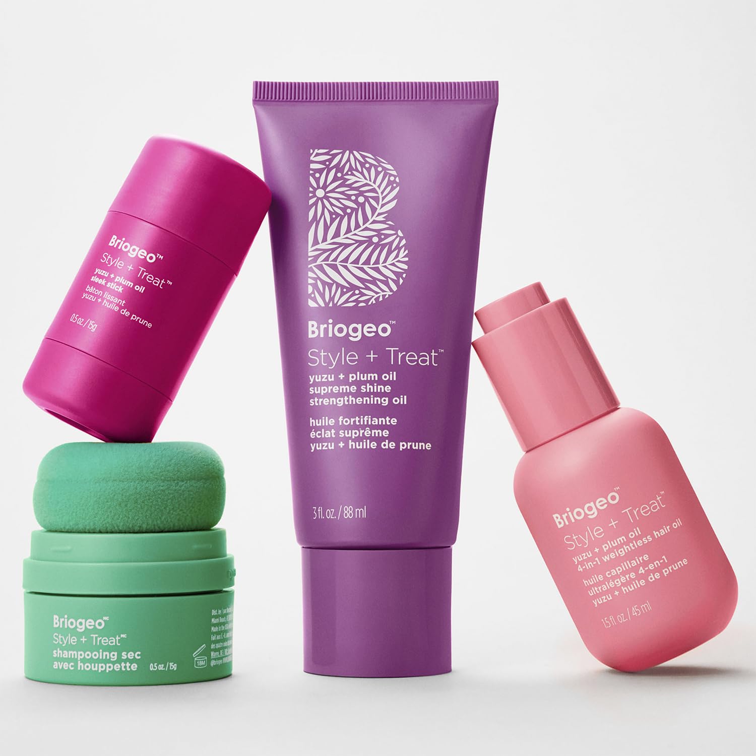 Briogeo applied to damp hair to show heat-protection preparation